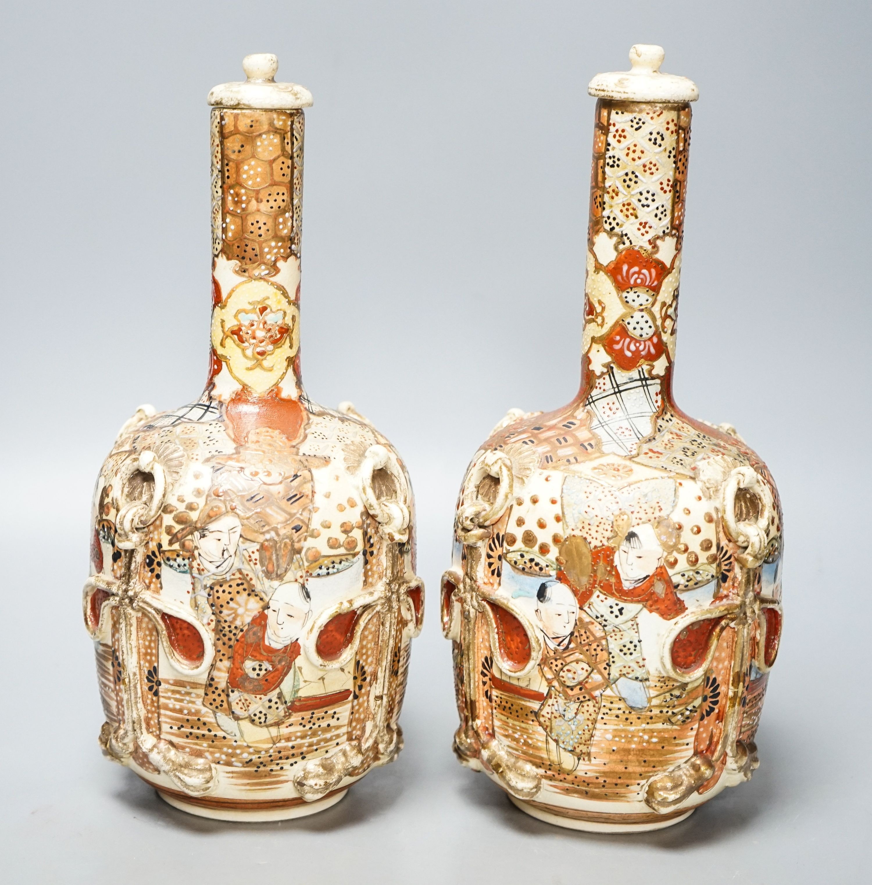 A pair of Japanese Satsuma pottery lidded bottle vases 27cm